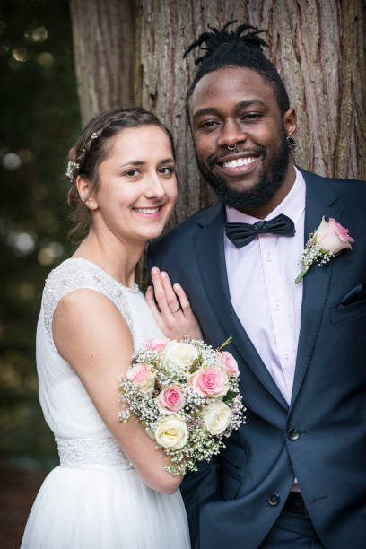 istock happy bridal couple smiling at camera 898559820