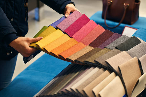 istock Choosing a fabric color in a store 898566104