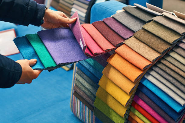 istock Choosing a fabric color in a store 898566160