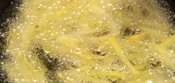 istock cooking potato fries in oil 898566270