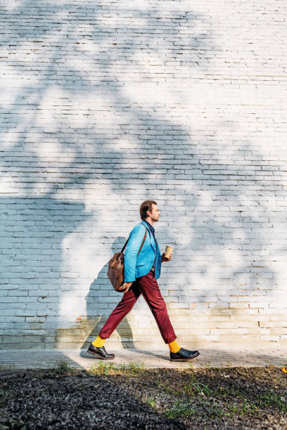 istock stylish man with coffee to go 898566746