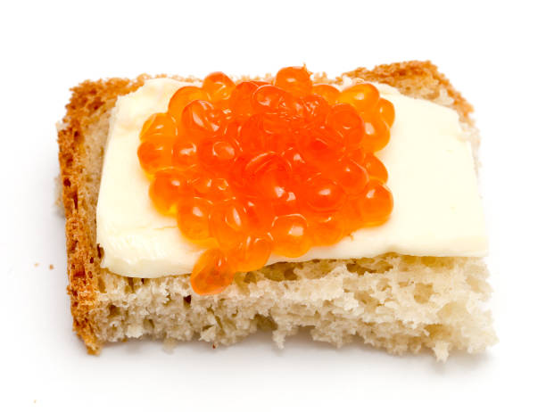 istock Red caviar sandwiches on white background 898570288