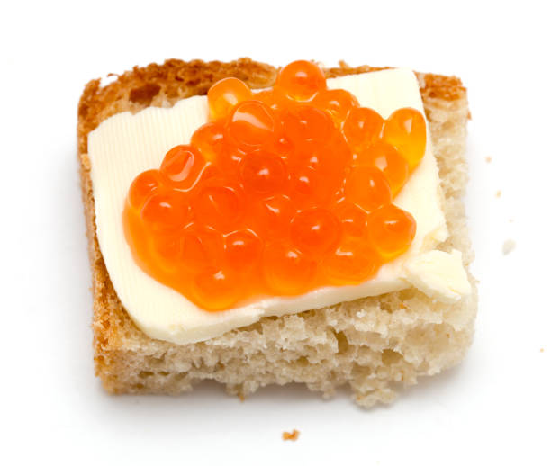 istock Red caviar sandwiches on white background 898570364