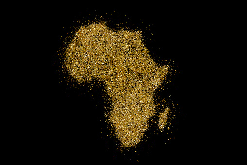 África en forma de brillo dorado sobre negro (serie) photo
