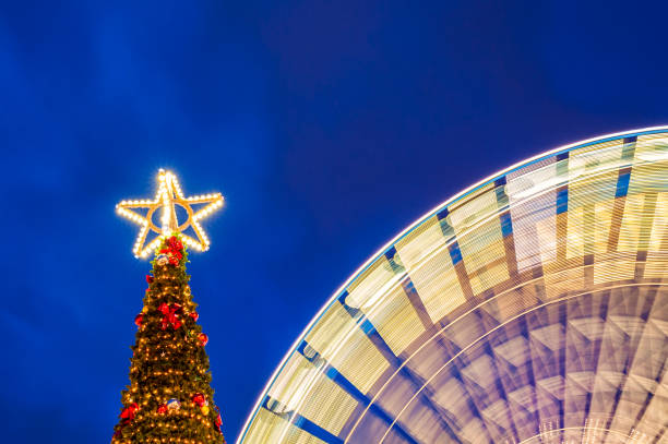 Outdoor Christmas Tree with Spinning Ferris Wheel in Lille, Northern France.