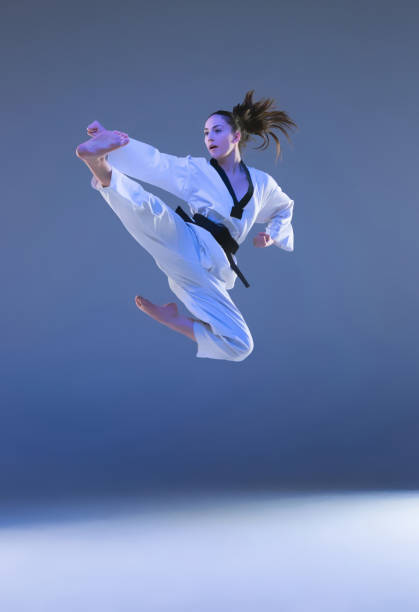 istock The karate girl with black belt 898575270