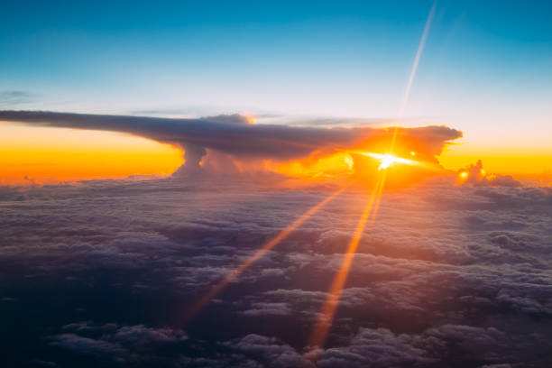 Sunset Sunrise Over Mountains From Height Of Airplane, Plane. Bright Blue, Orange, Yellow And Blue Colors Of Sunrise Sky Background. Warm And Cold Colors.