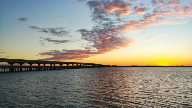 istock Twilight Sunset by Rippled Water, Bridge, River, South Carolina 898578802