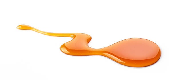 istock caramel sauce isolated on white 898581424