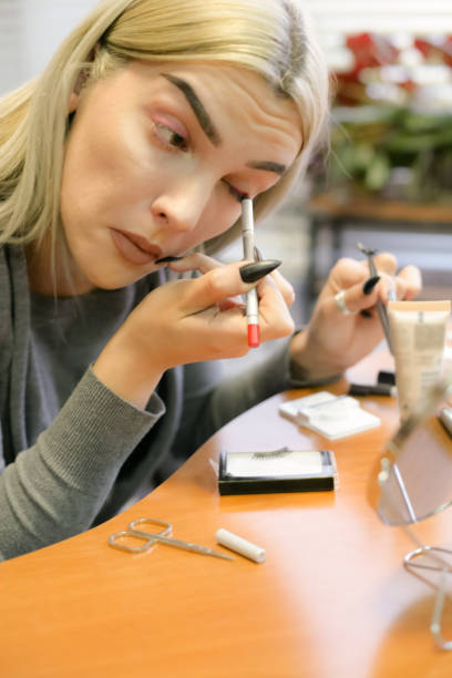 istock Young Girl putting her False Eyelashes 898582162