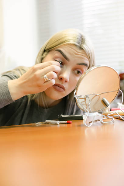 istock Young Girl putting her False Eyelashes 898582604