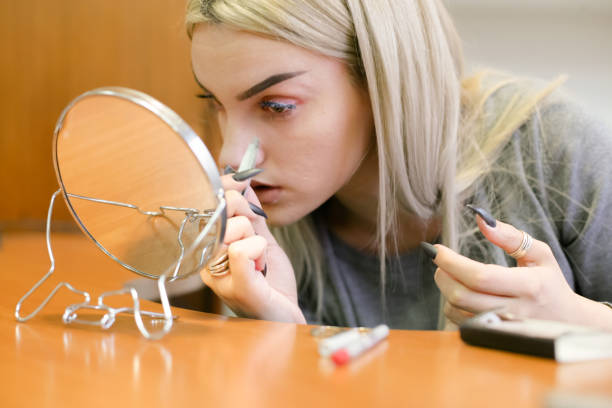 istock Young Girl putting her False Eyelashes 898582648