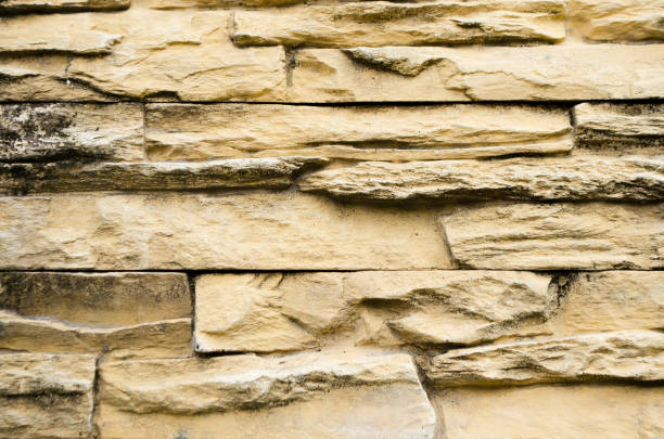 istock Background of yellow brick stone wall 898585504