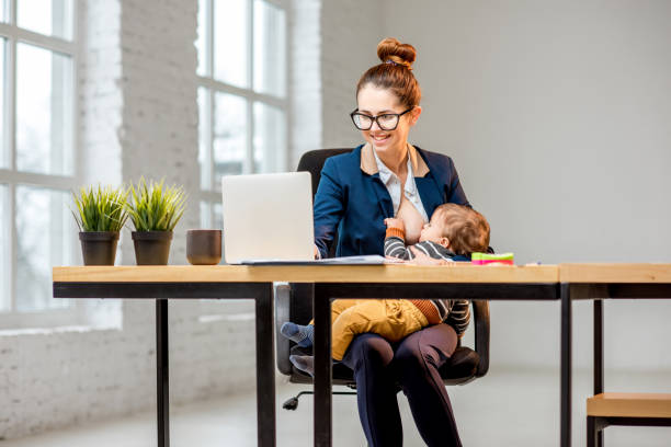 istock Multitasking businesswoman with her son working at the office 898586476