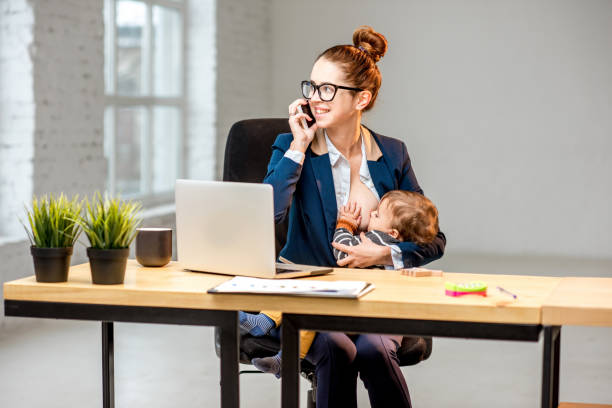 istock Multitasking businesswoman with her son working at the office 898586500