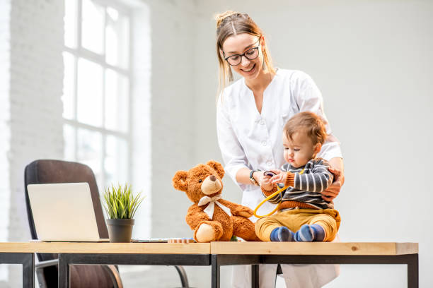 istock Pediatrician with a baby boy 898593392
