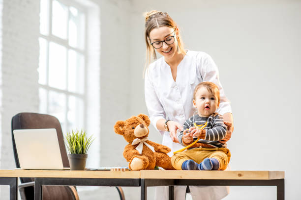 istock Pediatrician with a baby boy 898593424