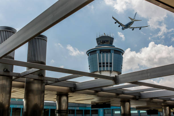 laguardia airport tower new york - flag american culture flying sky stock-fotos und bilder