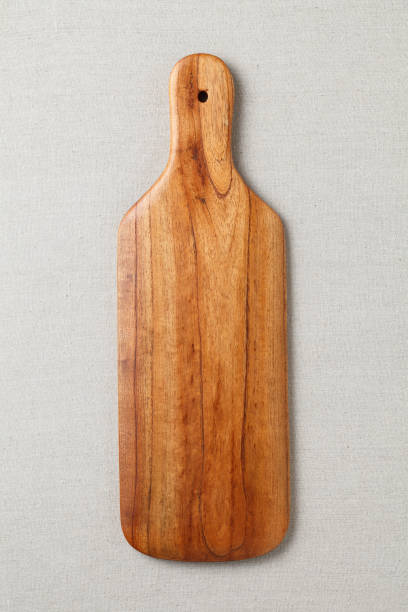 istock Handmade wood cutting board on the linen 898601074