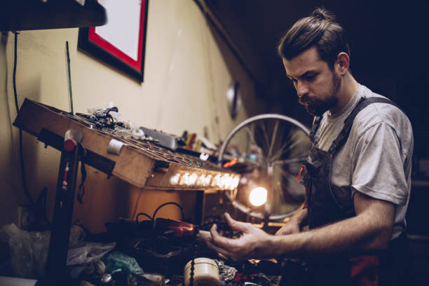 istock Repairman repairing bicycle 898602382