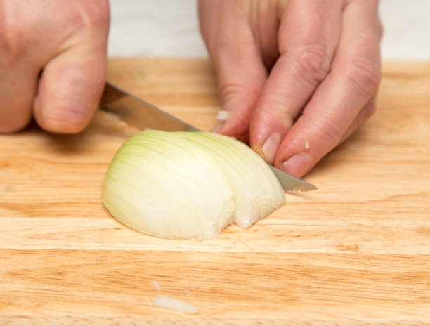 istock Cook chopped onion on the board 898608682