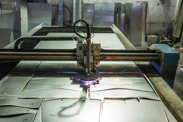 istock Plasma cut machine with program control cutting steel sheet with sparks in metalwork factory 898611458