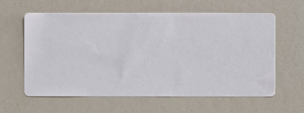 istock Stickers Label Close Up on Cardboard Background with Real Shadow. 898611780