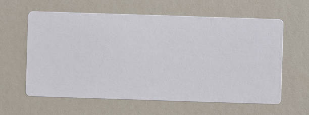 istock Stickers Label Close Up on Cardboard Background with Real Shadow. 898611812
