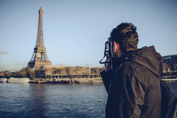 istock Man making photograph of Eiffel Tower 898615760