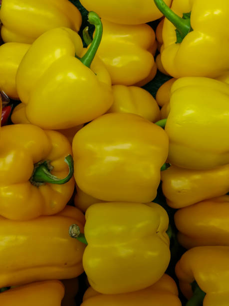 istock yellow bell pepper on a market stall 898616018