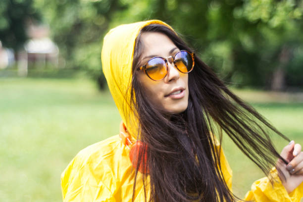 istock Woman and yellow raincoat 898620526
