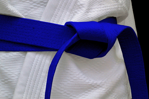 Close-up on a blue belt tied around a kimono.