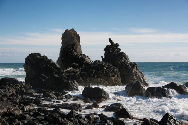 istock waves crashing on the rocks at Acitrezza in Sicily 898636618