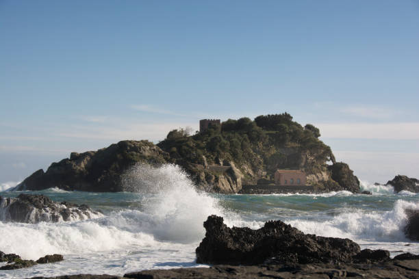 istock waves crashing on the rocks at Acitrezza in Sicily 898636636