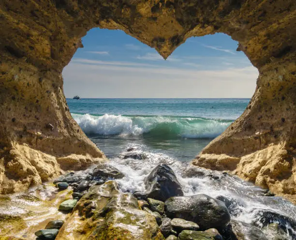 Photo of view of the ocean from a heart-shaped cave