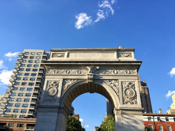 istock Washington square arch and buildings with blue sky 898645026