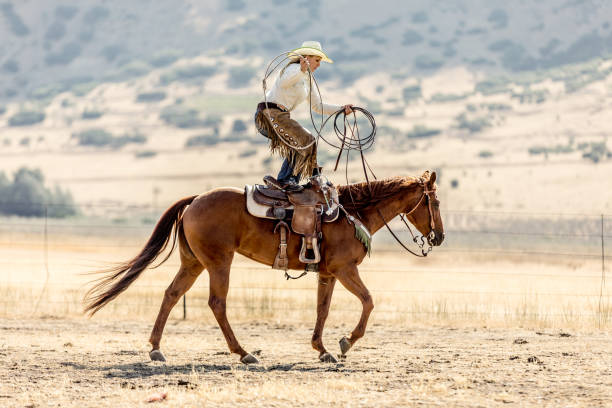 istock Cowgirl Stunt Horseback Riding 898648630