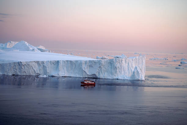 istock Arctic Icebergs with sunset on Arctic Ocean in Greenland 898651280