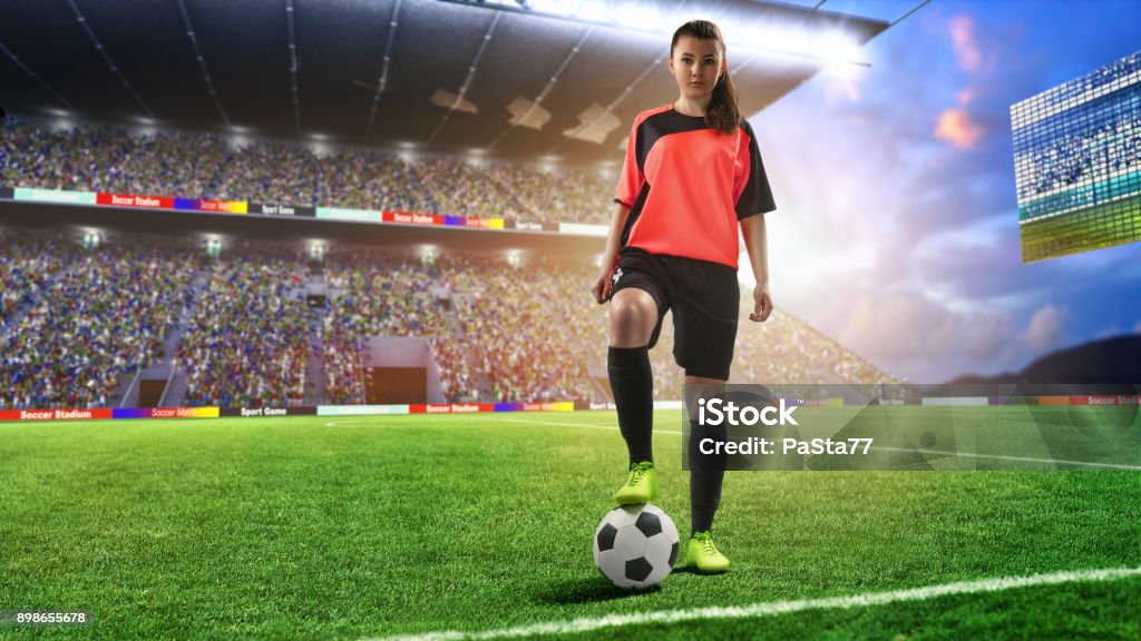 joueuse de football en rouge uniforme sur le terrain de soccer - Photo de Football libre de droits