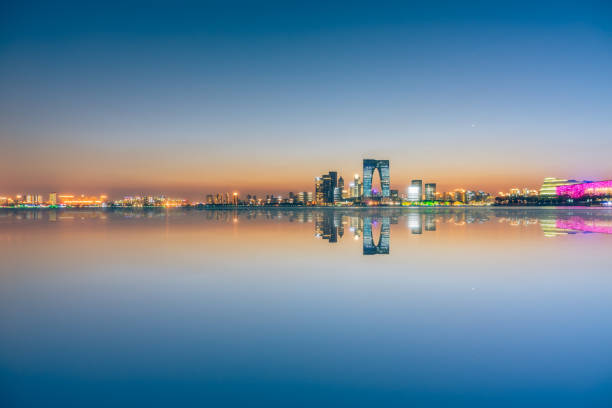 istock City Skyline By River at twilight 898661510