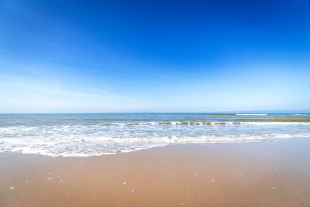 istock Beach in the summer with water coming in 898664640