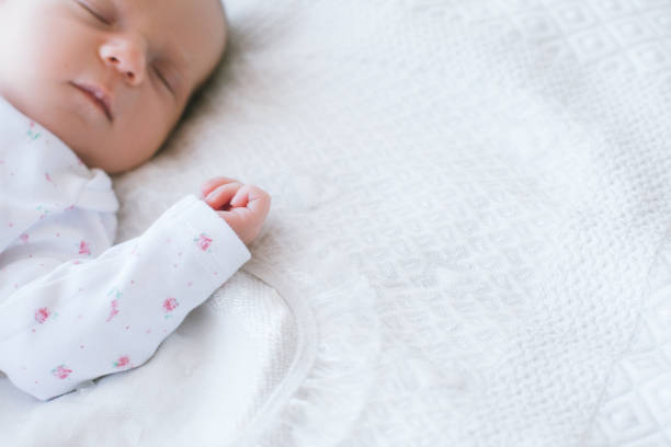 istock a newborn has a healthy day's sleep 898664706