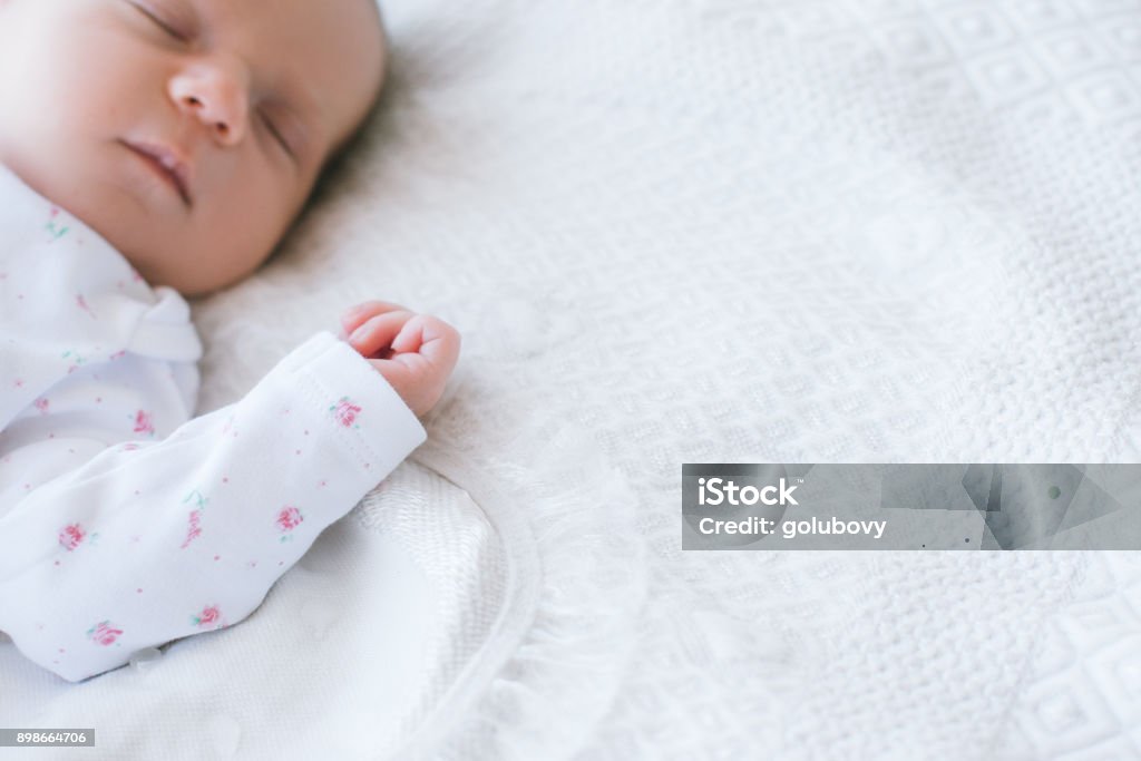 a newborn has a healthy day's sleep a newborn has a healthy day's sleep. sweet dreaming. happy motherhood. copy space concept. Baby - Human Age Stock Photo