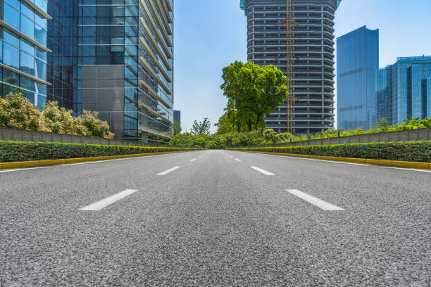 istock City empty road with modern buildings background 898666150