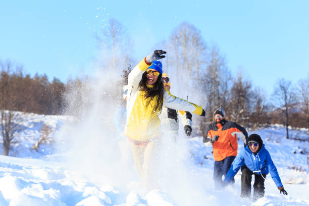 istock Friends having fun in snow 898666154