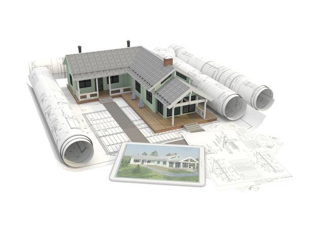 istock Model wooden house in the Scandinavian style end tablet computer. The isolated architectural object on a background of rolls of engineering drawings end planes. 3D render. 898666890