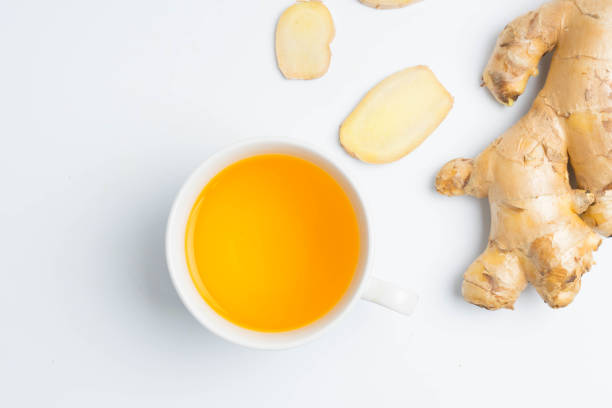 istock hot ginger tea ginger ale ginger beer in glass with ginger slice on white background 898667010