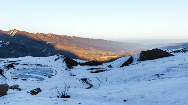 istock Last rays of sun on a snowy mountain peak 898671652