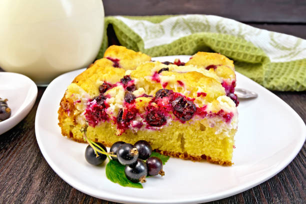 istock Pie with black currant in plate on dark board 898674392