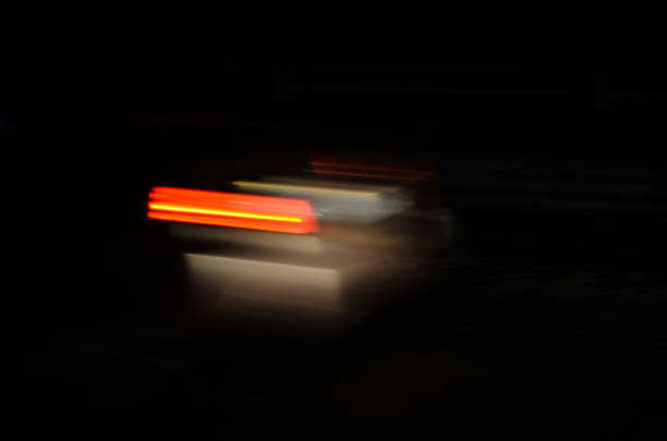 Trails of the car lights on night road